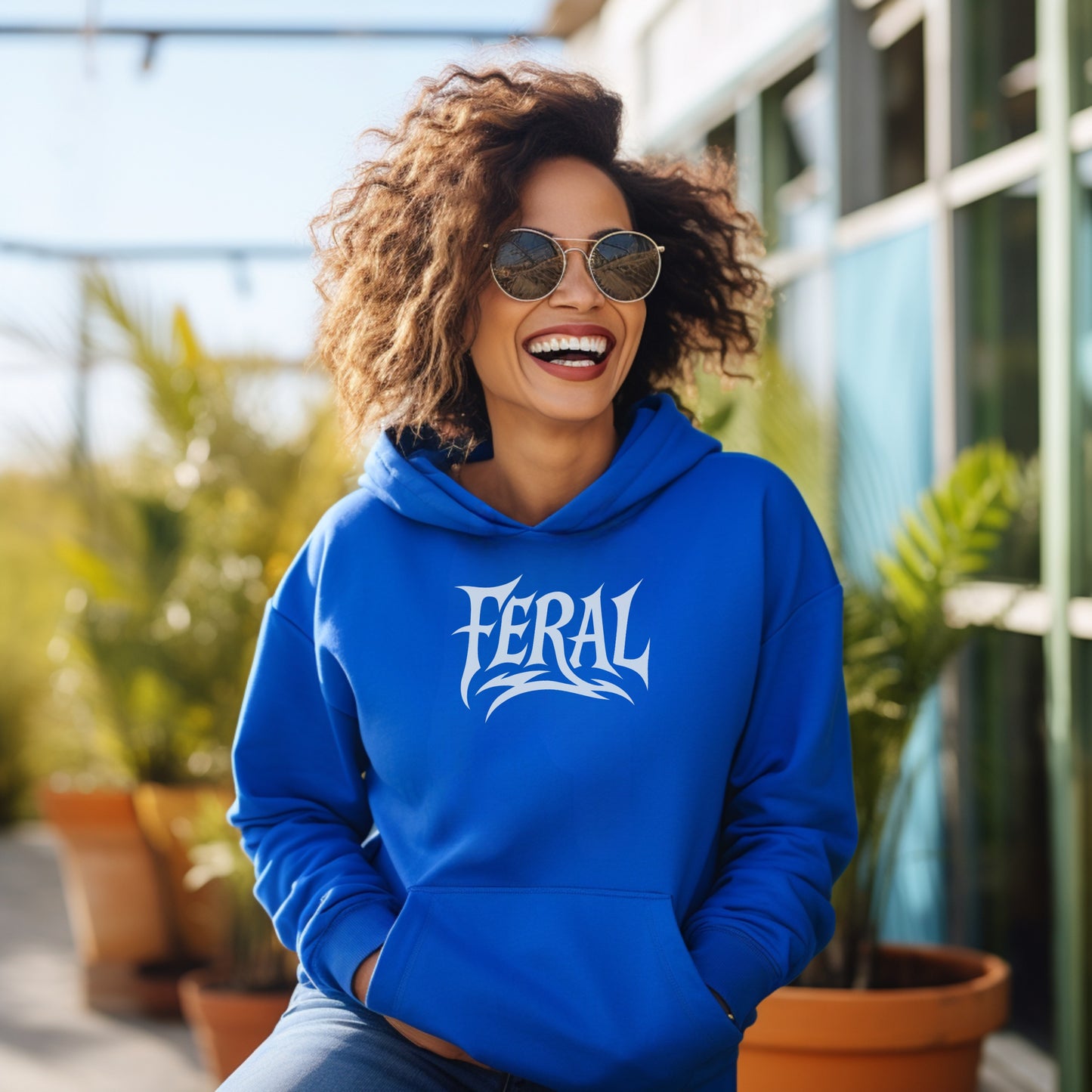 Stylish Blue Hoodie Featuring Bold FERAL Print Design