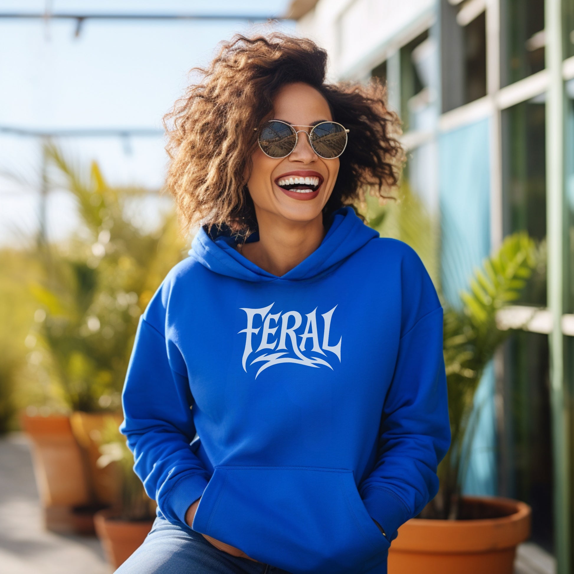 Stylish Blue Hoodie Featuring Bold FERAL Print Design