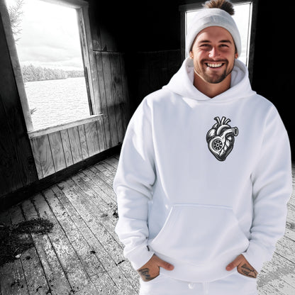 Smiling Man in White Hoodie with Unique Heart Design