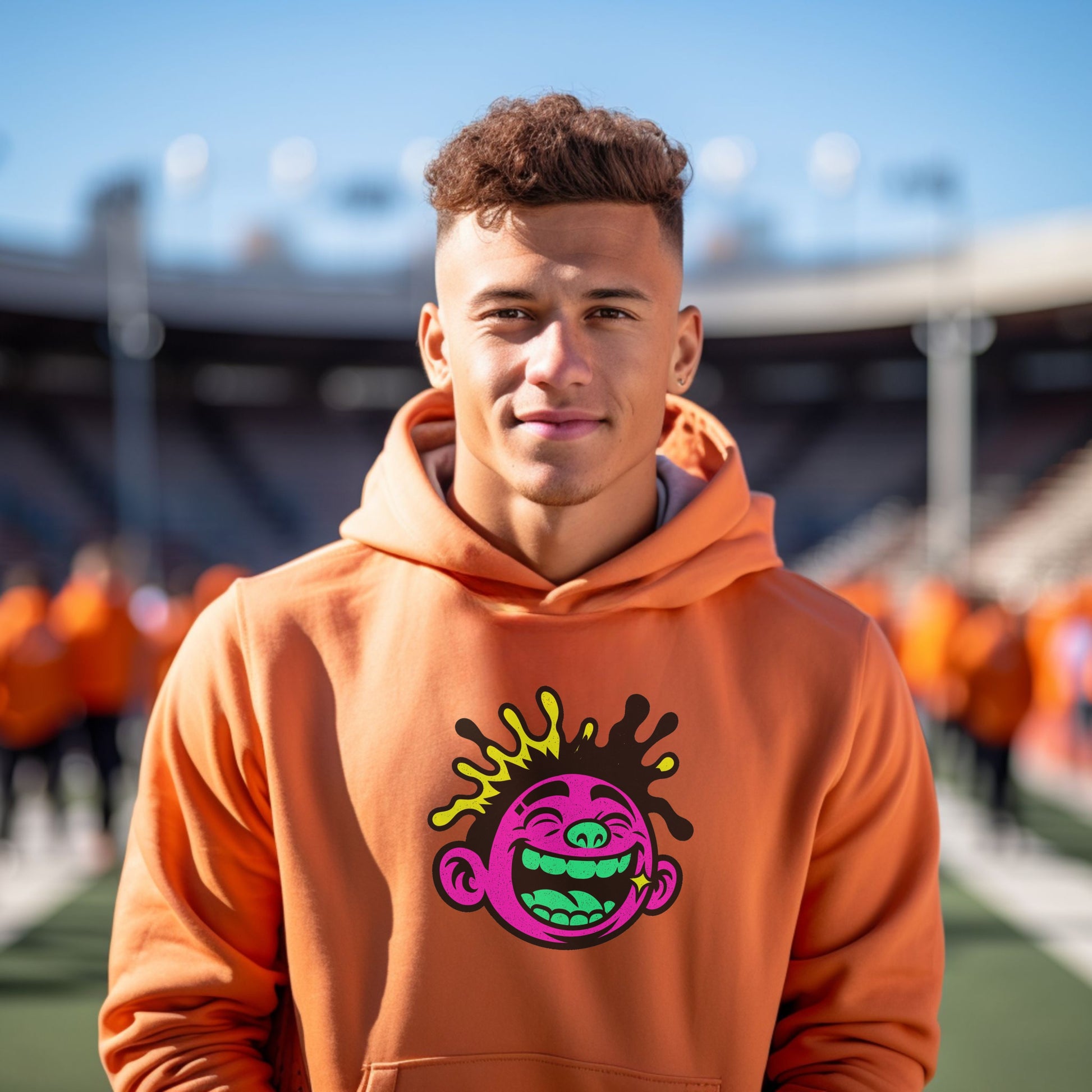 Bright Orange Hoodie with Cartoon Face Design